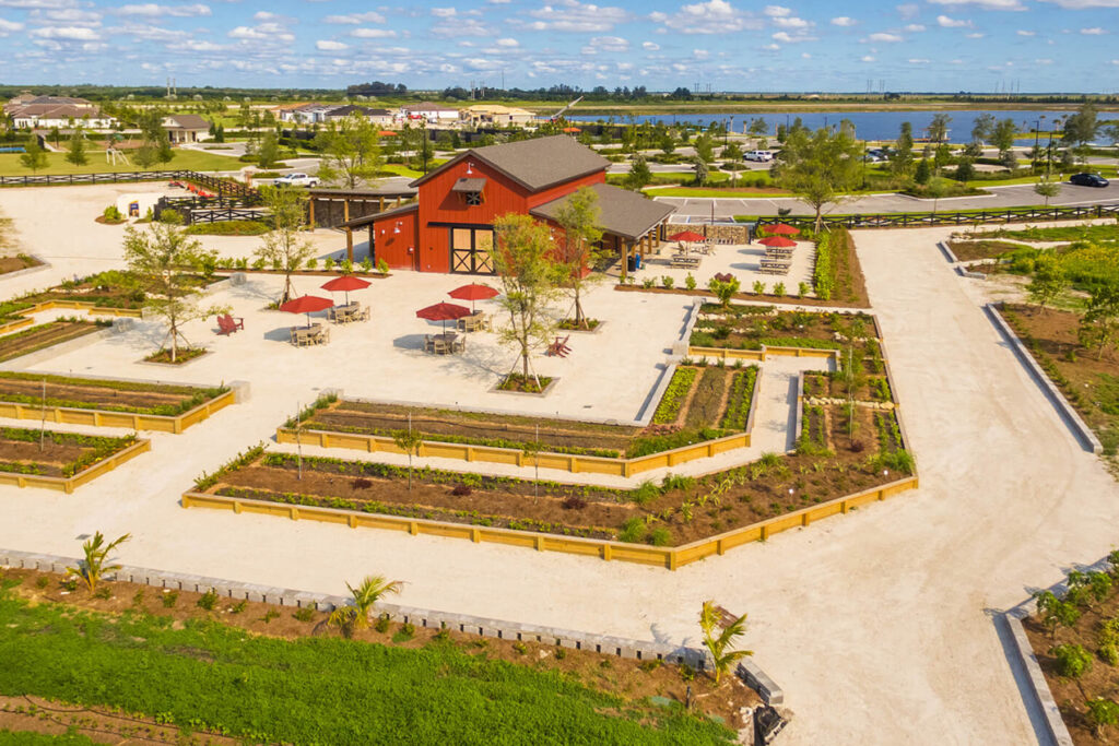 Red barn surrounded by plots of farm.