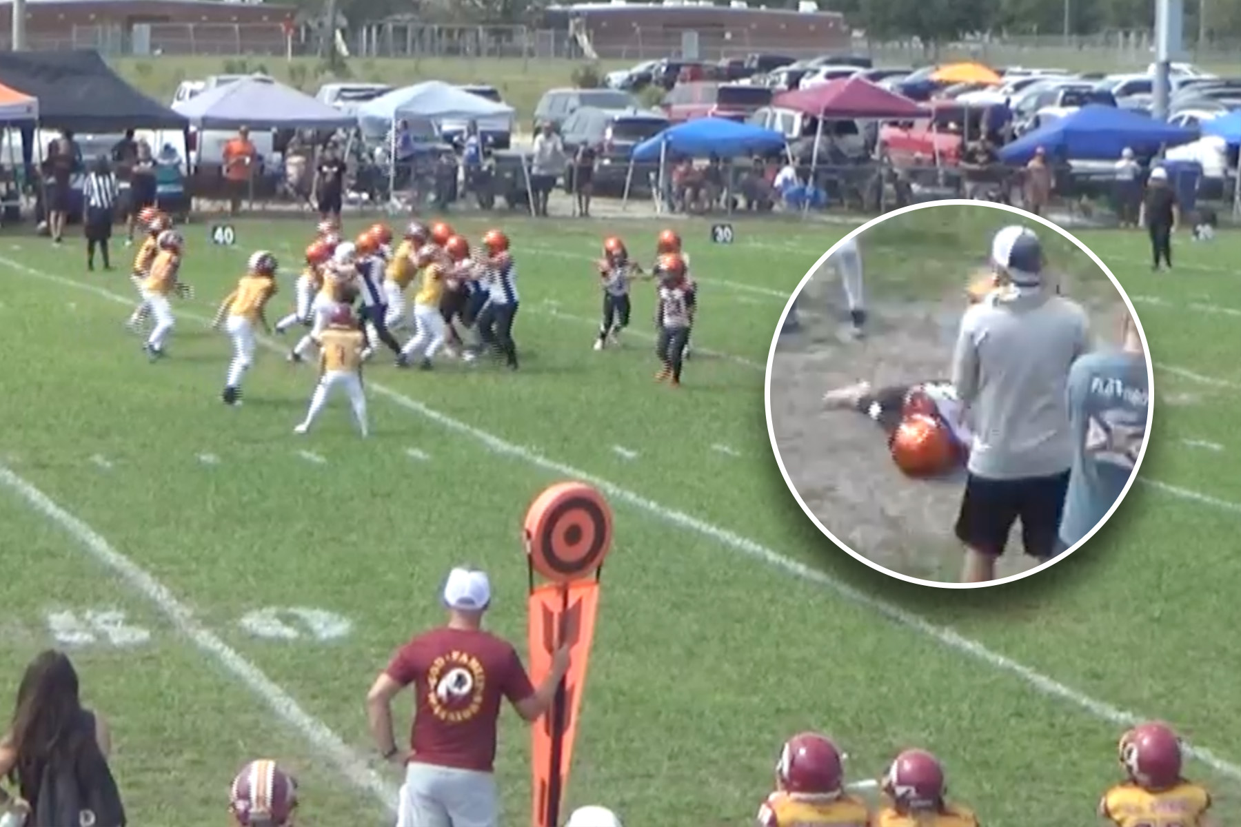 Florida football kids football game with inset of child on ground from hit.