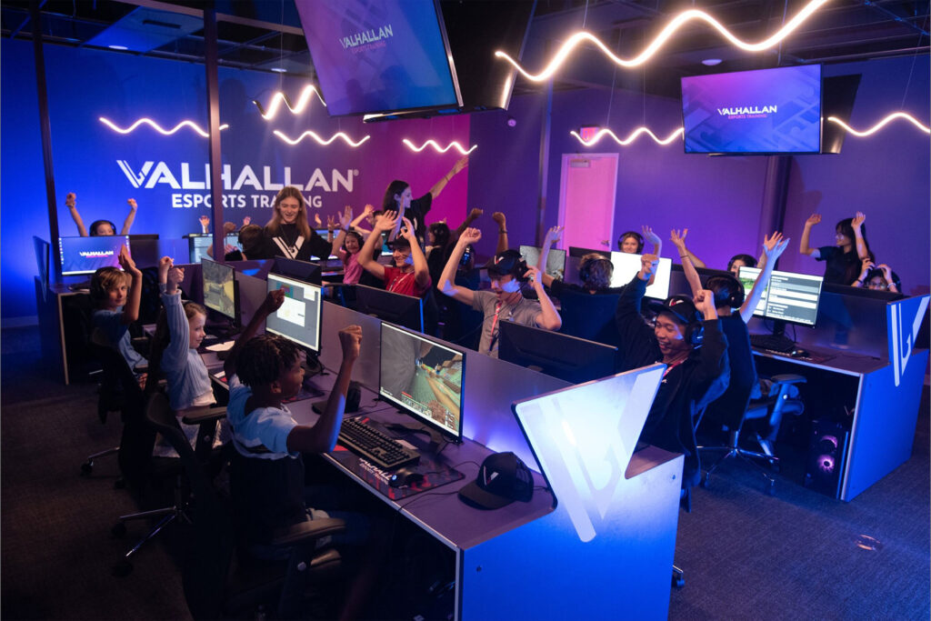 Teens staring at computer screens at a gaming center in St. Johns County, Florida.