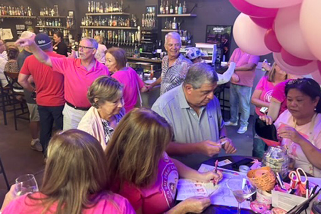 Crowd at breast cancer fundraiser.