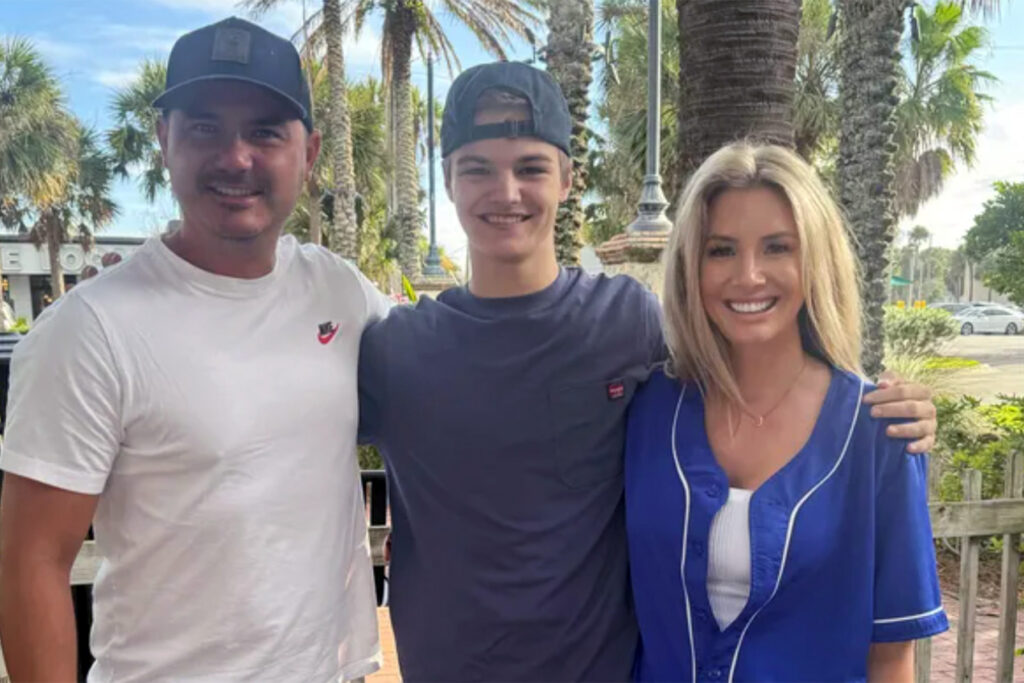 Man and woman on either side of Carson Tucker in front of a Palm Tree.