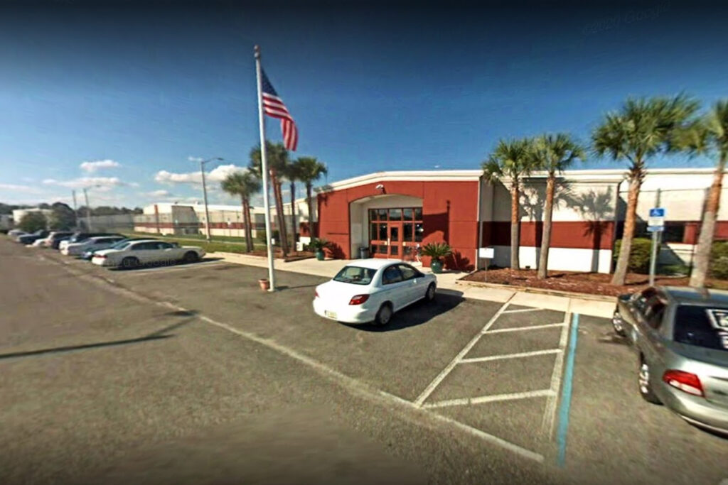 Red building with an American flag.