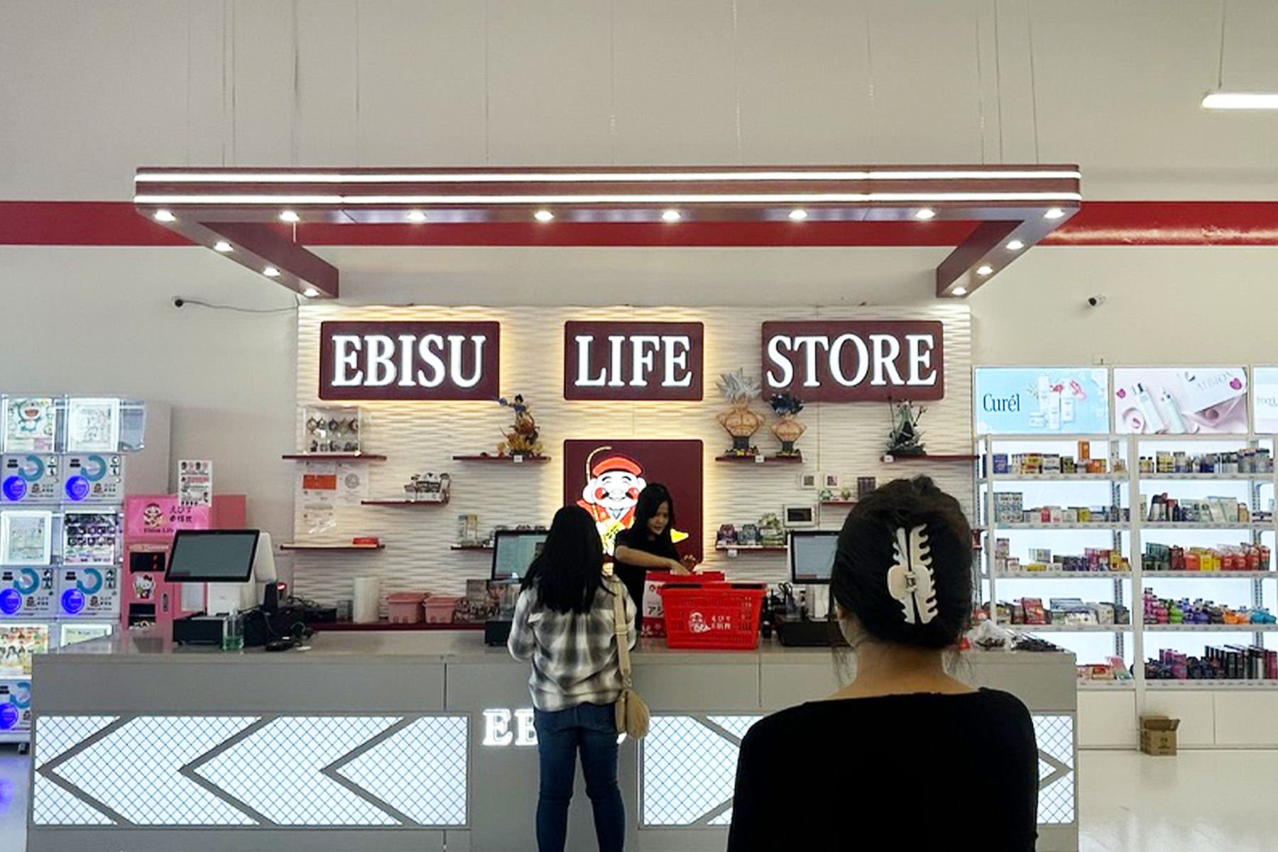 A woman stands in line at the counter of an Ebisu Life Store in Florida.