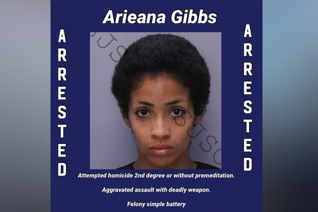 Police headshot of woman with short hair.