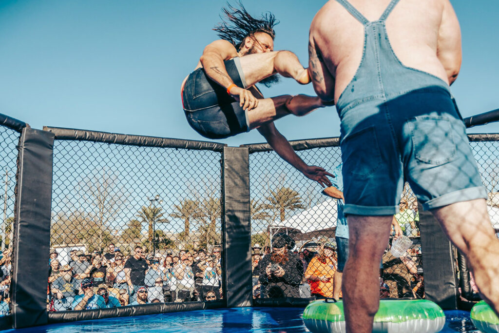 Men sparring in an outdoor ring.