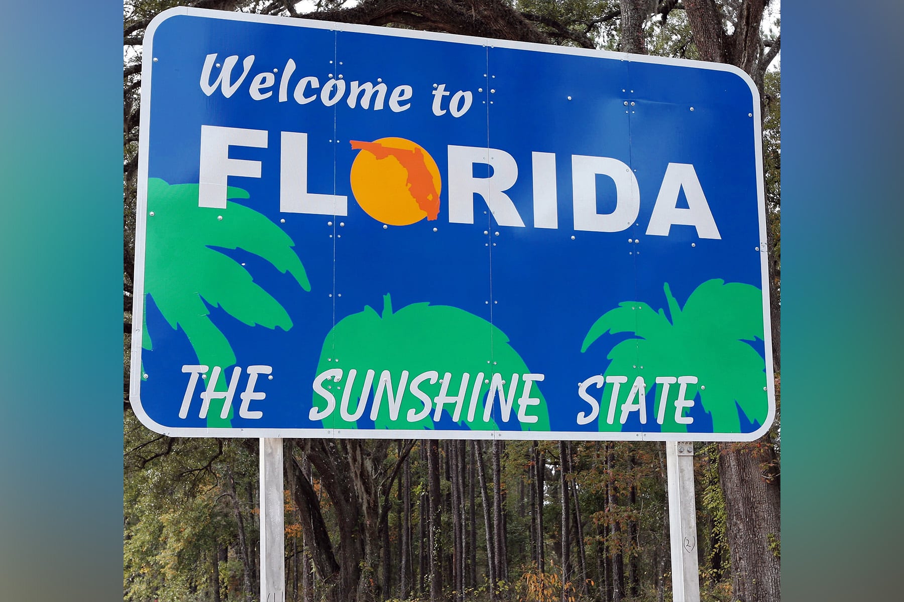 A blue sign welcoming visitors to Florida.