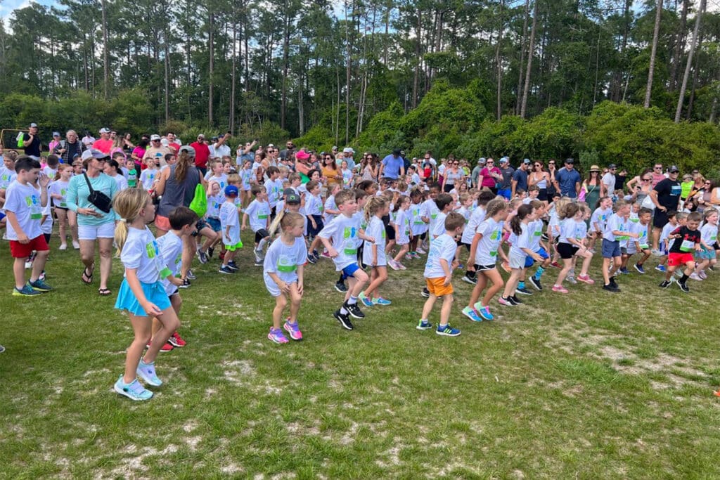 Group of children warming up before running.