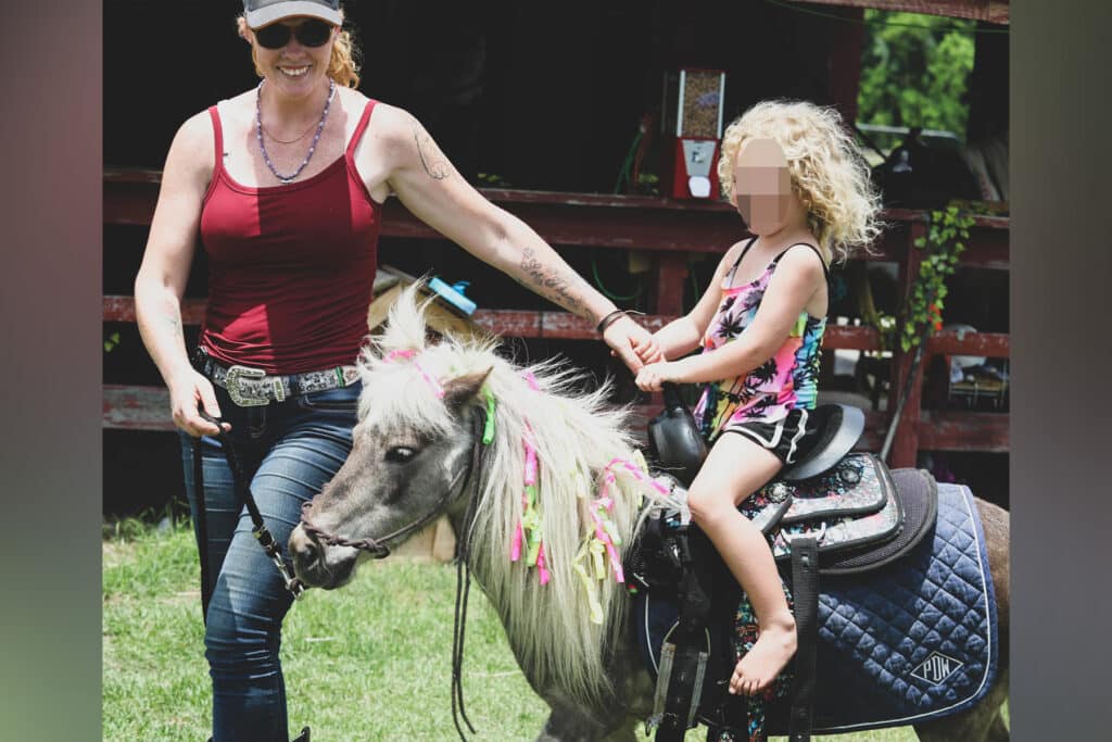 Little girl on a pony.