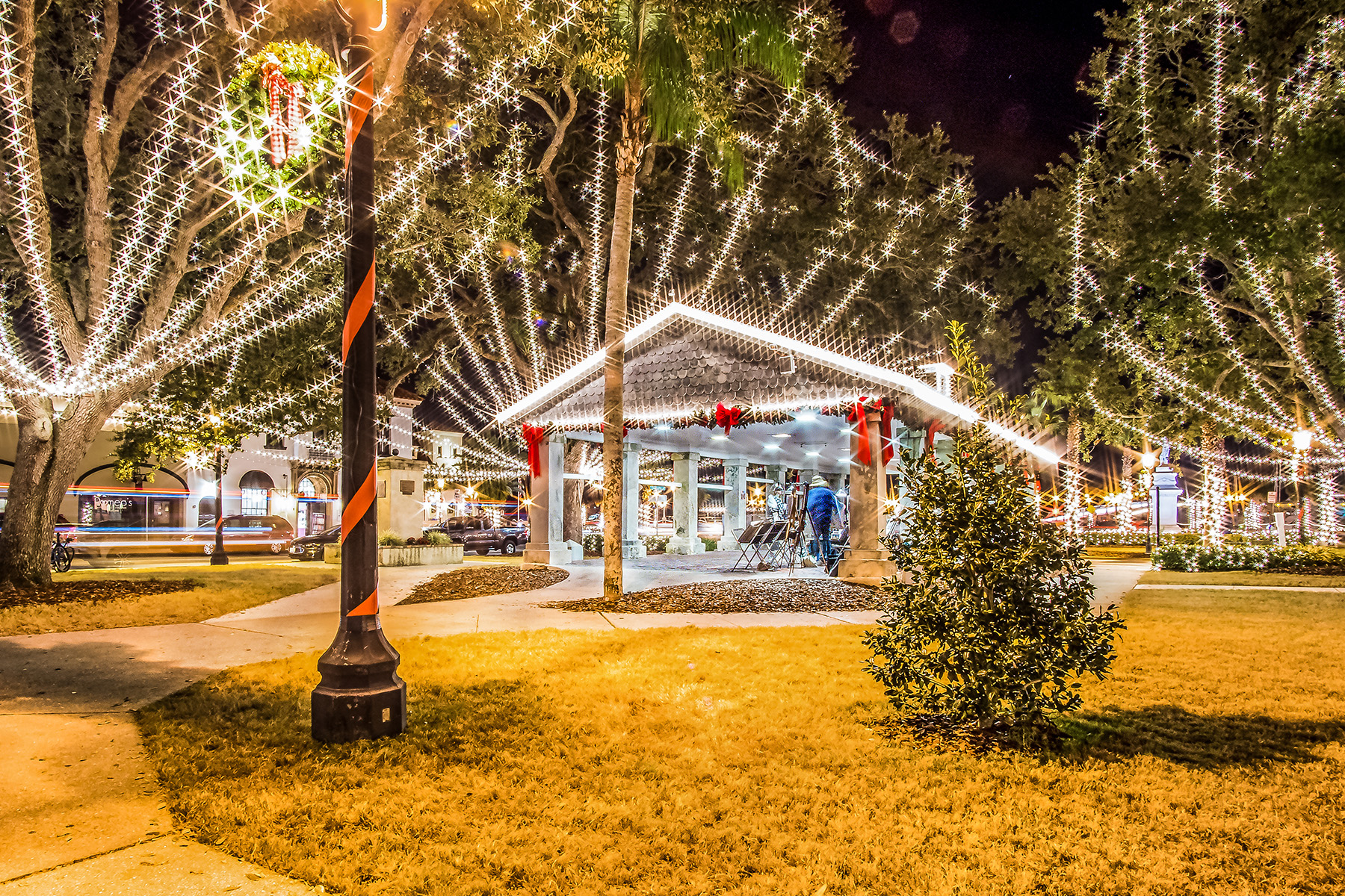 St. Augustine's town square lit up with white lights at night.