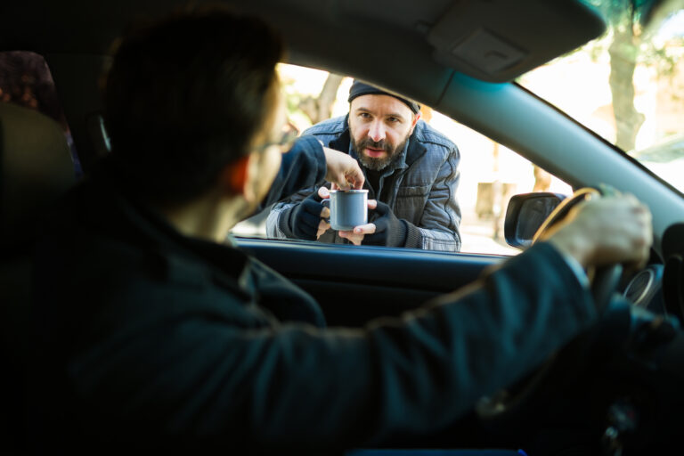 Stock photo of man asking driver for money