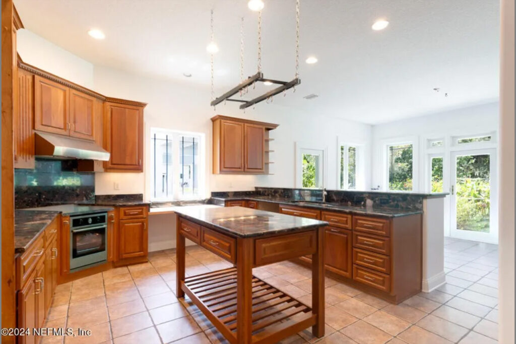 Brown kitchen with a central island.