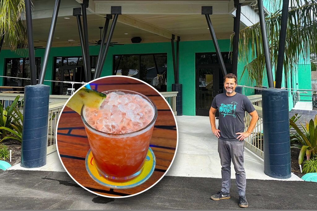 Green exterior of an under-construction building with an inset of a pink cocktail.