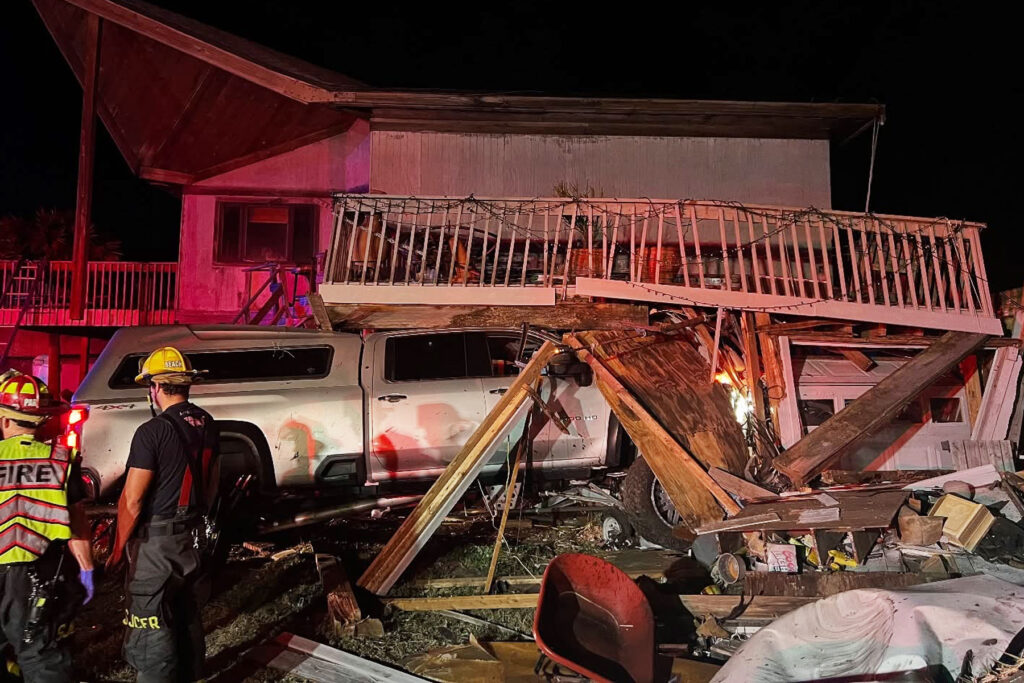 picture of a truck that smashed into a house
