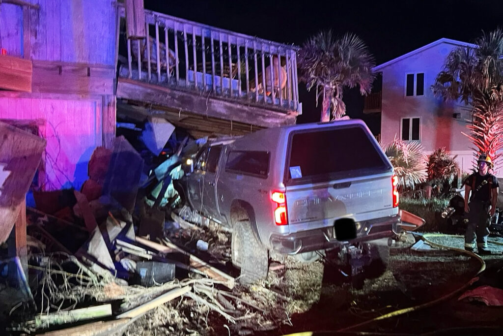 picture of truck that smashed into a home