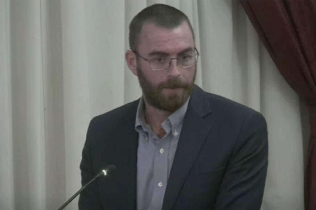 Picture of a man at a meeting
