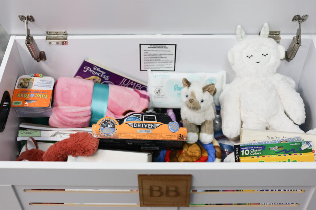 Whit box filled with children's toys.