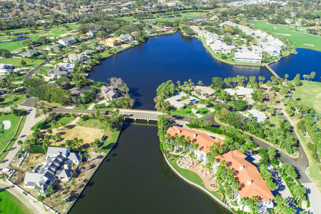 Aerial image of Ponte Vedra Beach with a expansive pond.