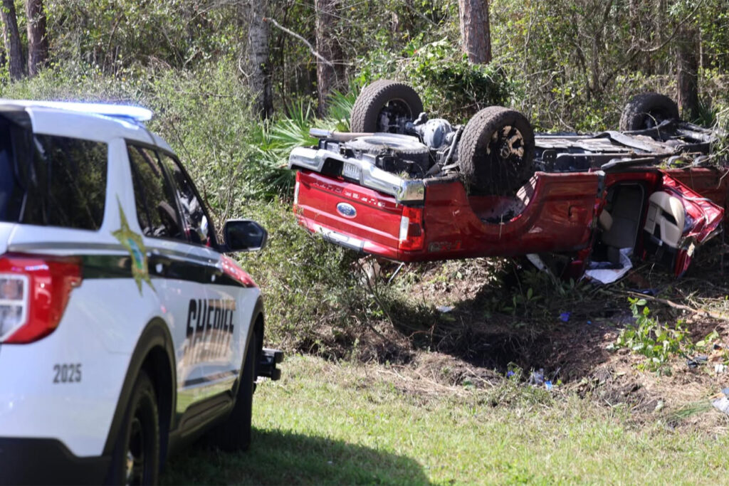 overturned red truck