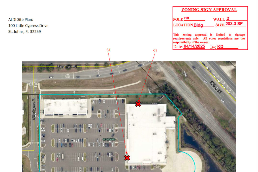 Aerial view of a building showing the location of two new signs.