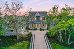 Two-story home with a long driveway.