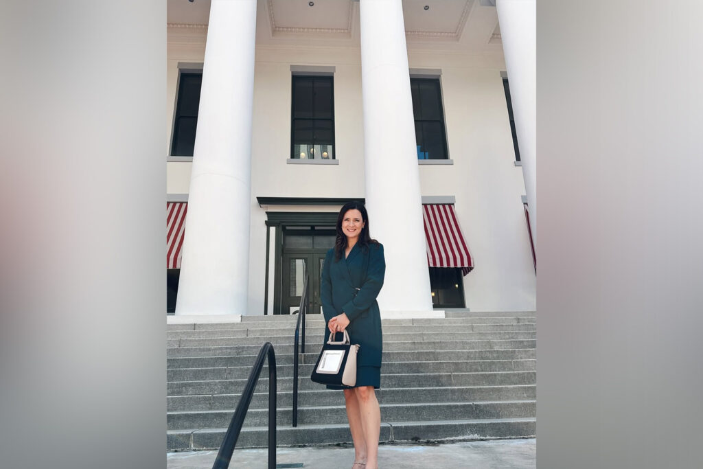 Picture of woman in front of building