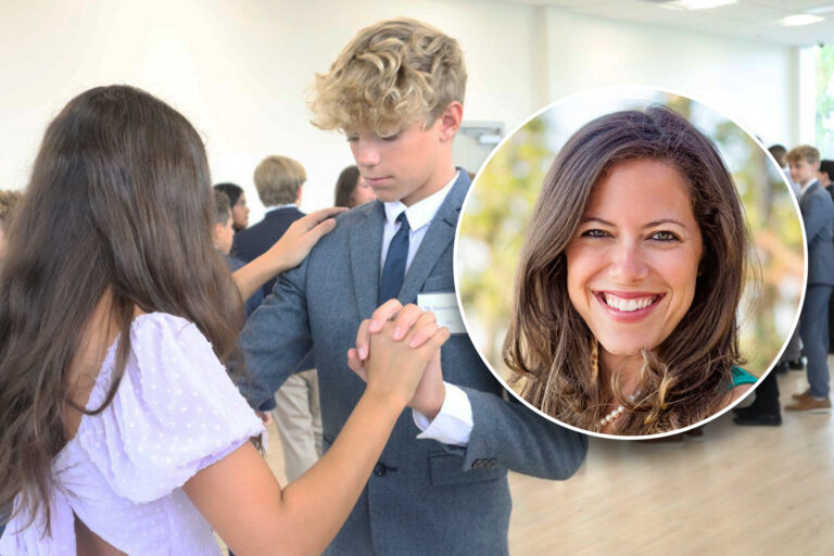 Two teens dance.