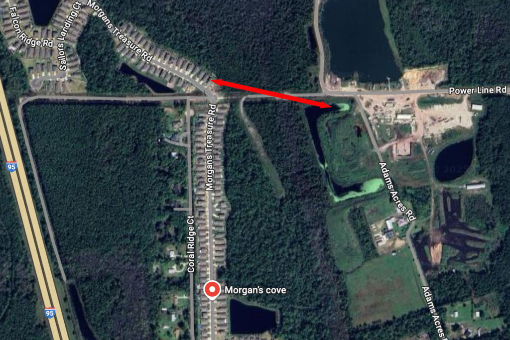 An aerial map showing a red arrow connecting a residential road and Indianhead Biomass waste treatment facility.