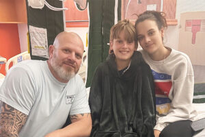 Boy with sister and father
