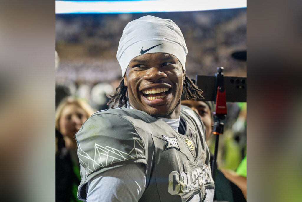 Travis Hunter smiling in his uniform at the University of Colorado.