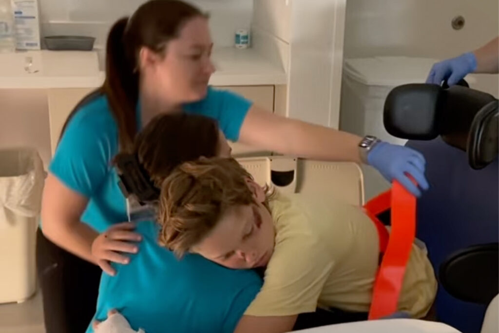 Boy hugging nurse