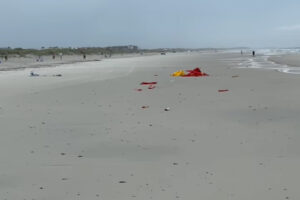 a beach with a broken lifeguard station