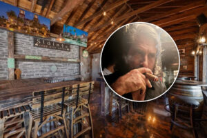 Interior of an Irish bar with bar owner.