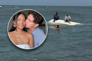 A couple in an inset over a picture of a capsized boat