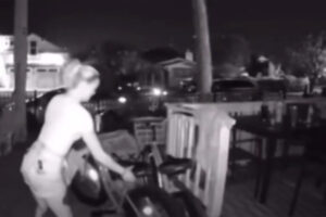 Woman stealing a bike