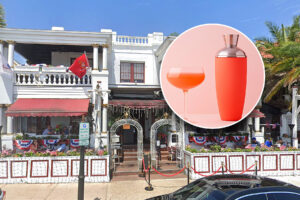 A white building with an inset of a pink cocktail.