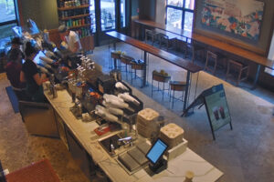 Man in white shirt at Starbucks counter