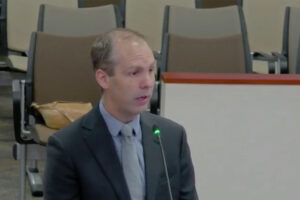 Man speaking at meeting