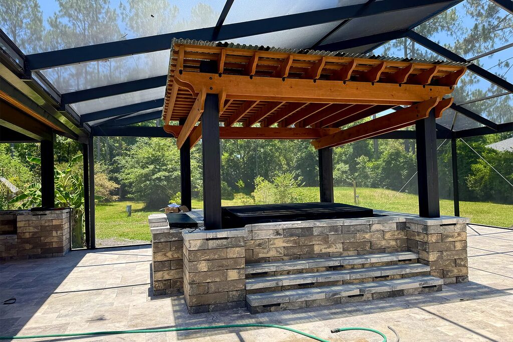 Pergola over a hot tub outside.