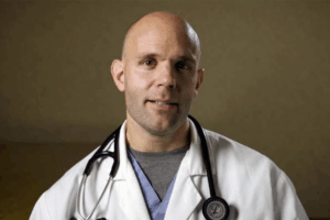Doctor wearing a white lab coat and a stethoscope.