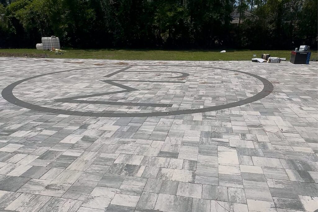 Paver design with MJ initials.