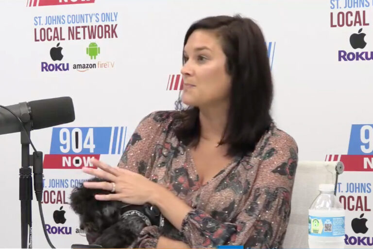 woman and her dog being interviewed
