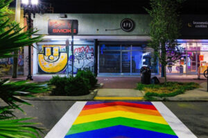 A rainbow colored crosswalk.