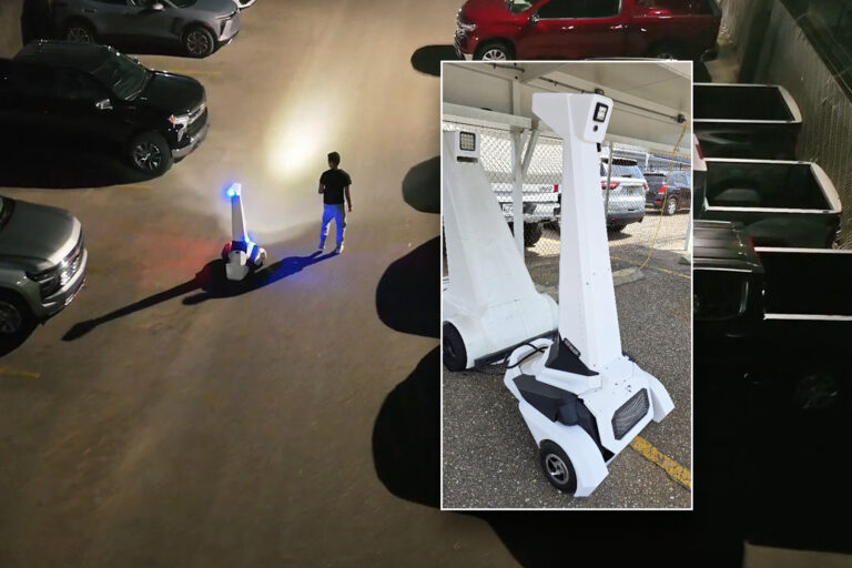 Man in Jacksonvill walks with a white machine with flashing blue lights at night.