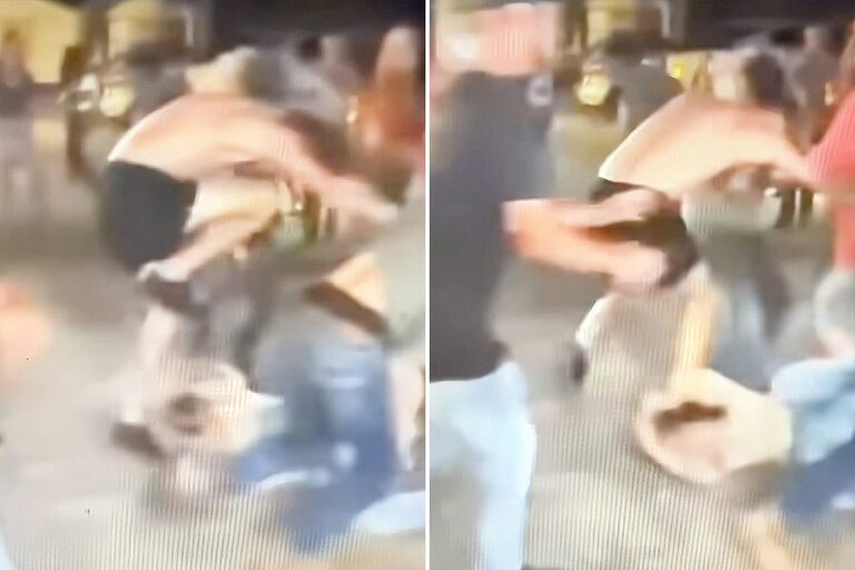 Shirtless man shown stomping on another man's head.